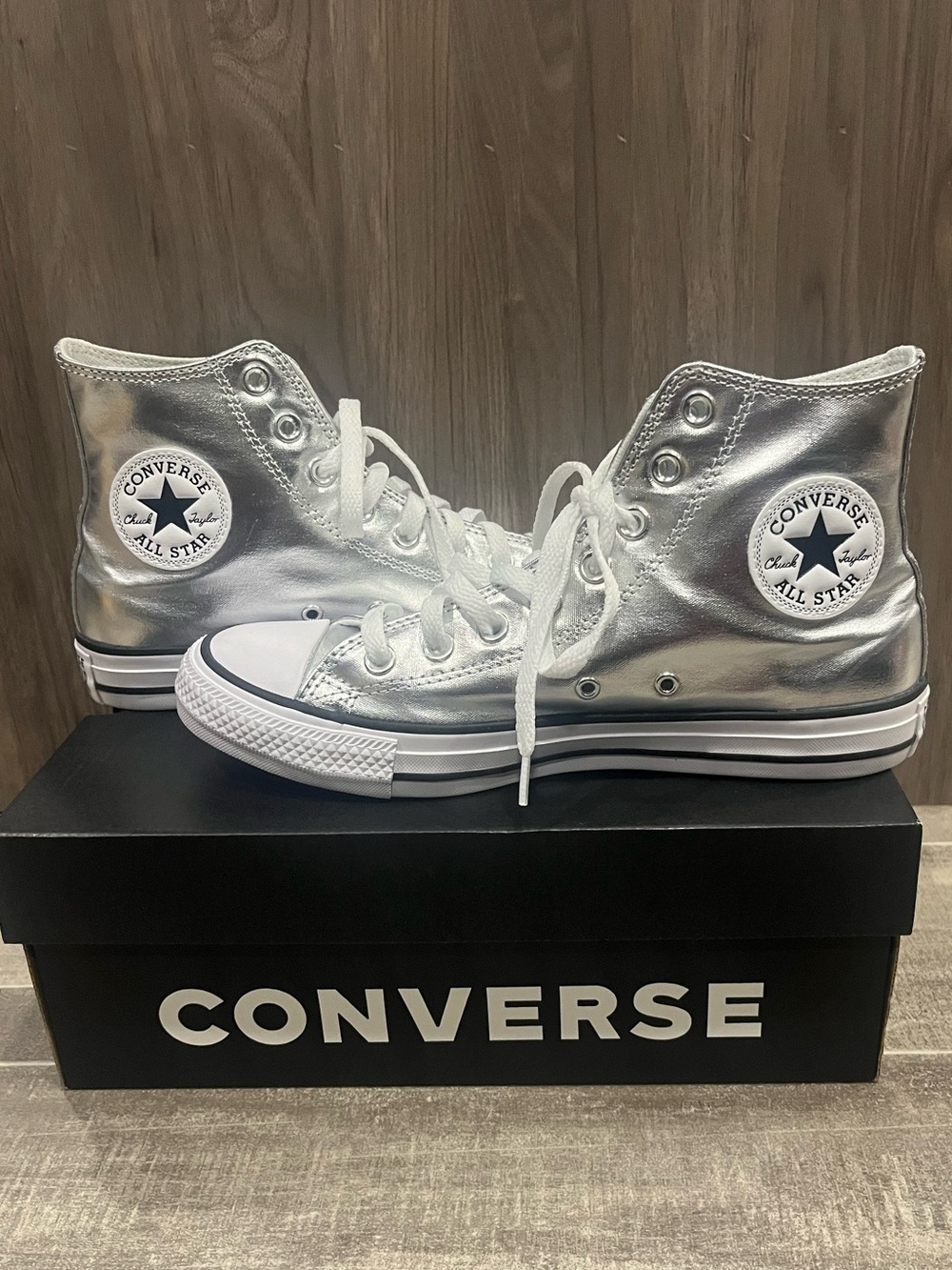 Silver hi top all star Converse sneakers